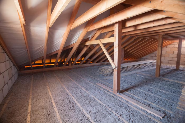 Ecowool insulation is poured in the attic