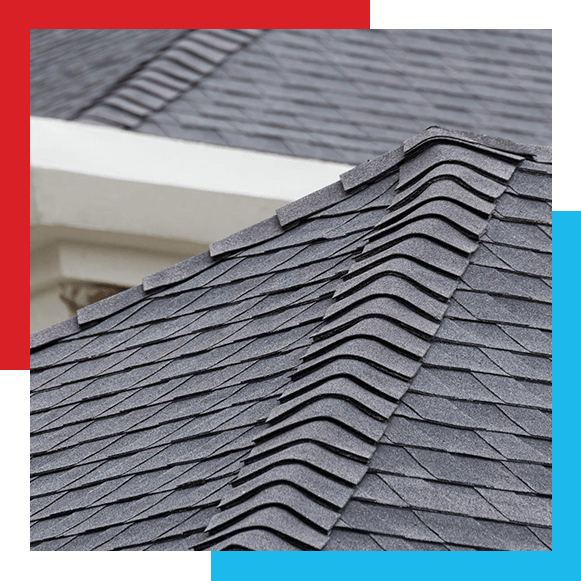 edge of Roof shingles on top of the house, dark asphalt tiles on the roof background.